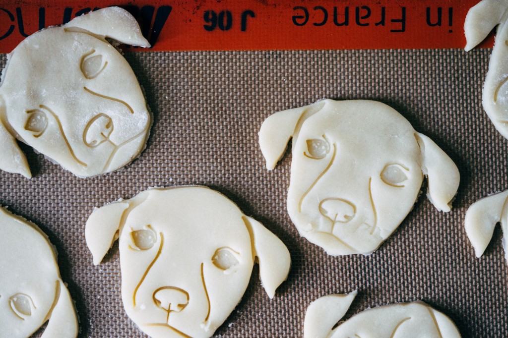 cookie dough cutouts in the shape of puppy's head