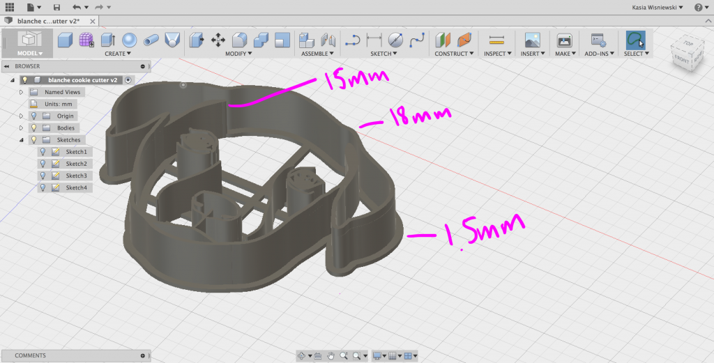 Fusion 360 interface with SVG file of dog face, angle tilted, with pink written text
