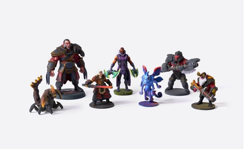 group of 3d printed gaming characters and miniatures